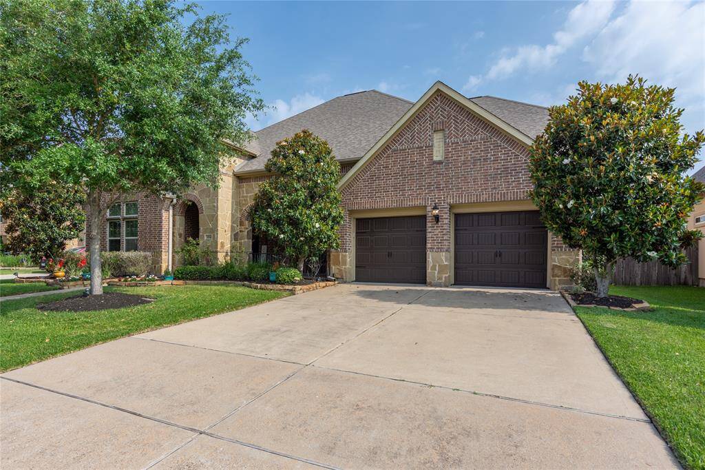 Long driveway and 3 car tandem garage