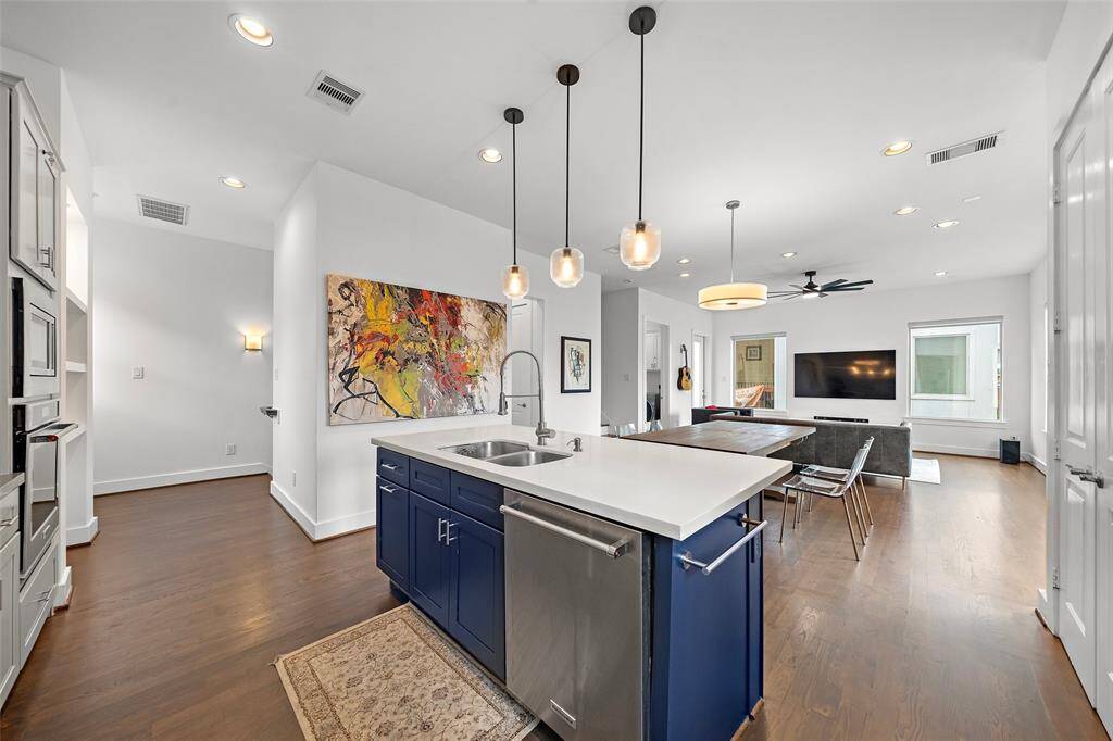 2nd Floor: Kitchen, Living/Dining, Utility Room, Half-bath, Small Patio