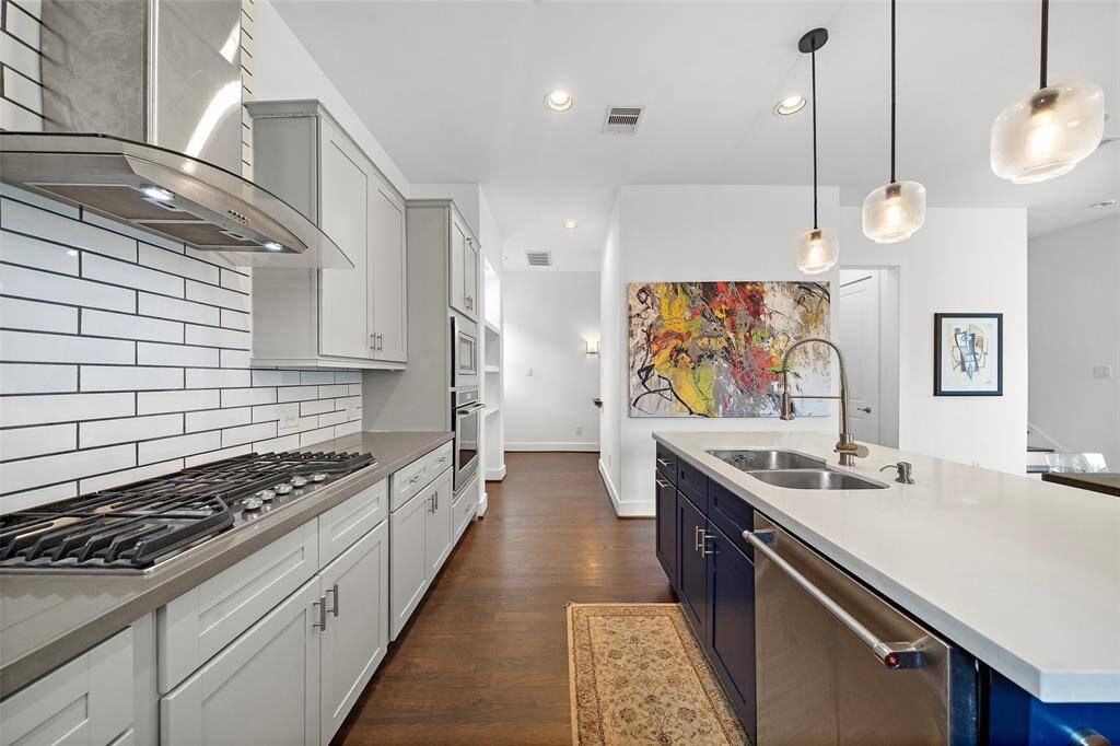 2nd Floor: Kitchen, Living/Dining, Utility Room, Half-bath, Small Patio
