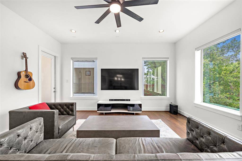 2nd Floor: Kitchen, Living/Dining, Utility Room, Half-bath, Small Patio