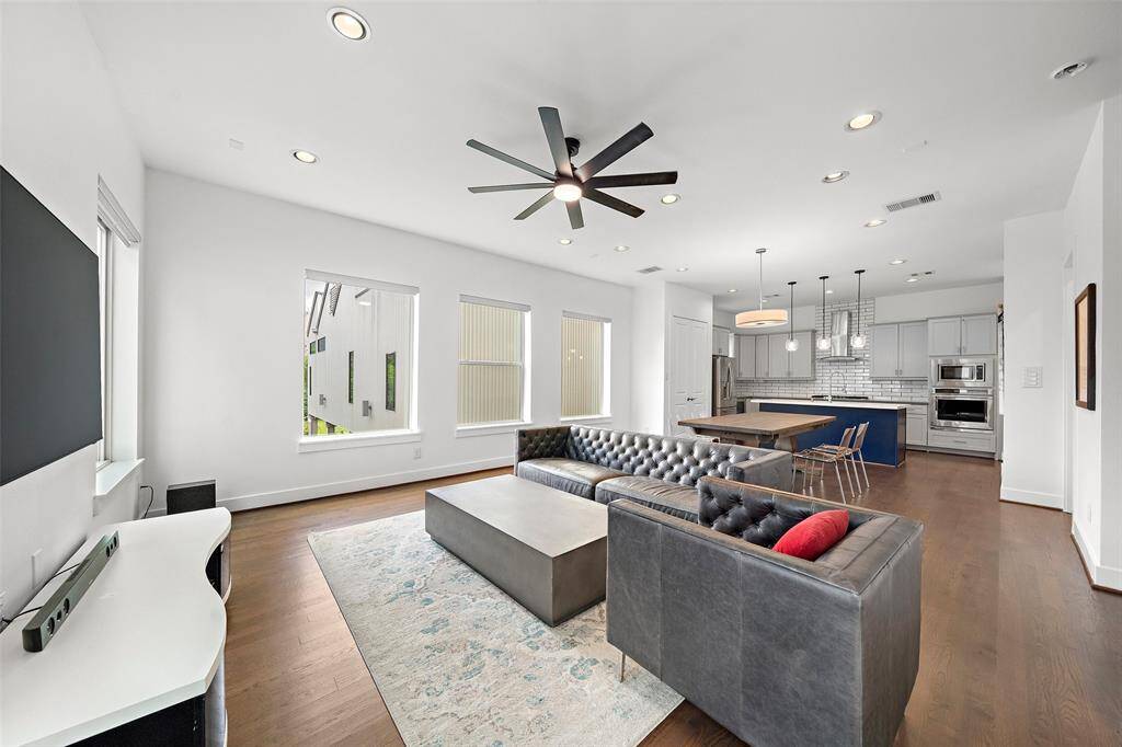 2nd Floor: Kitchen, Living/Dining, Utility Room, Half-bath, Small Patio