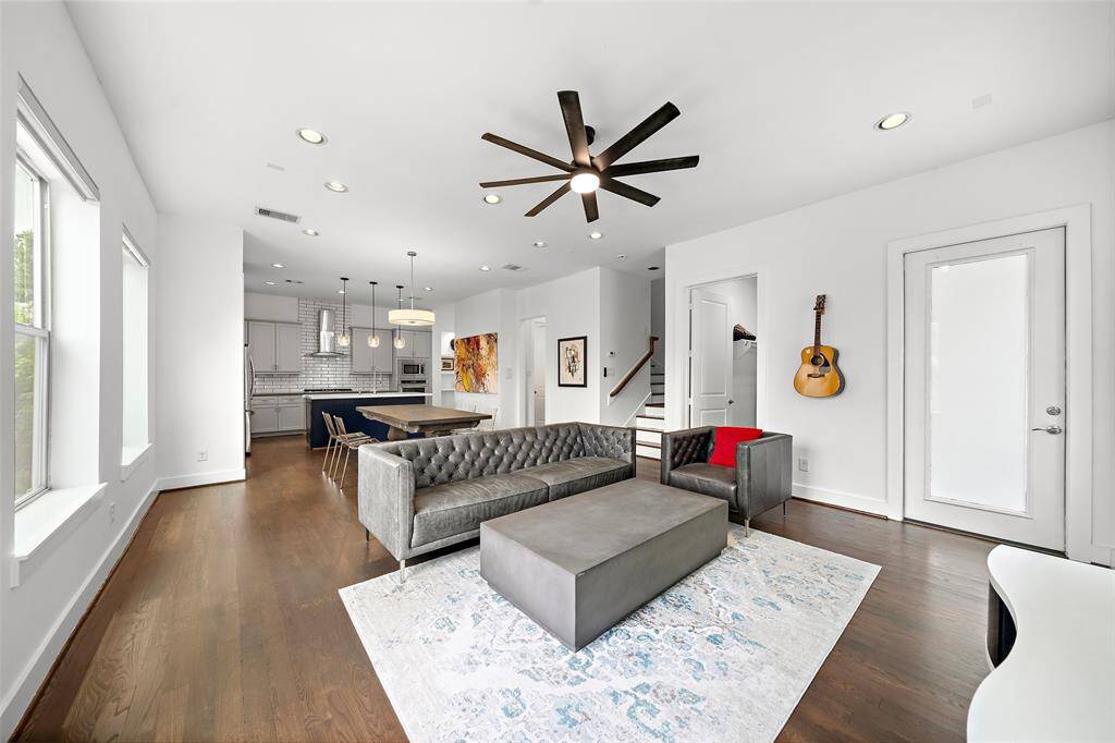 2nd Floor: Kitchen, Living/Dining, Utility Room, Half-bath, Small Patio