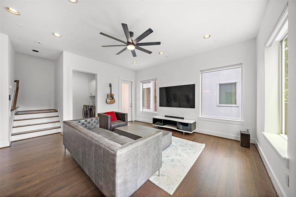 2nd Floor: Kitchen, Living/Dining, Utility Room, Half-bath, Small Patio