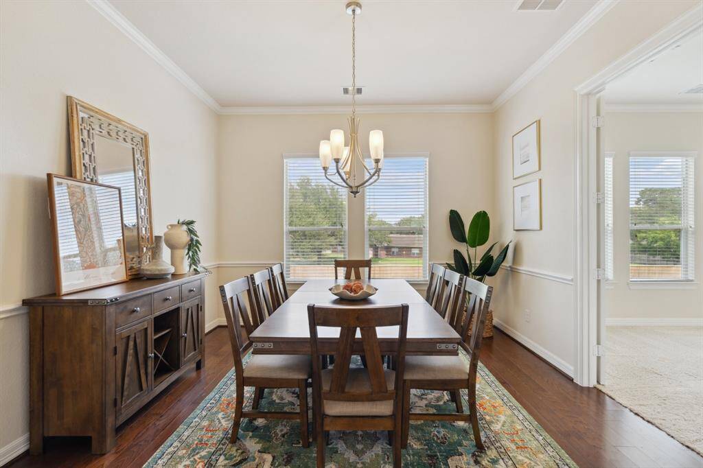 Bathed in natural light, the formal dining room offers a cheerful setting for everything from casual meals to holiday gatherings.