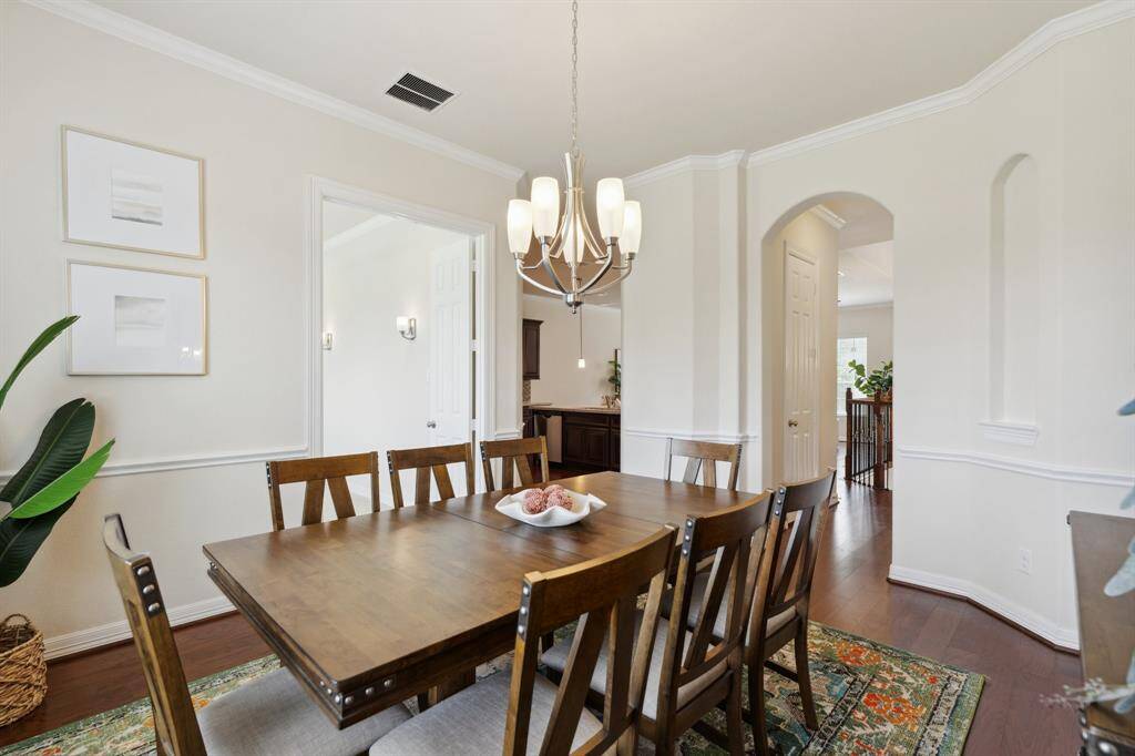 The formal dining area is quietly tucked away but just steps from the kitchen and living space.
