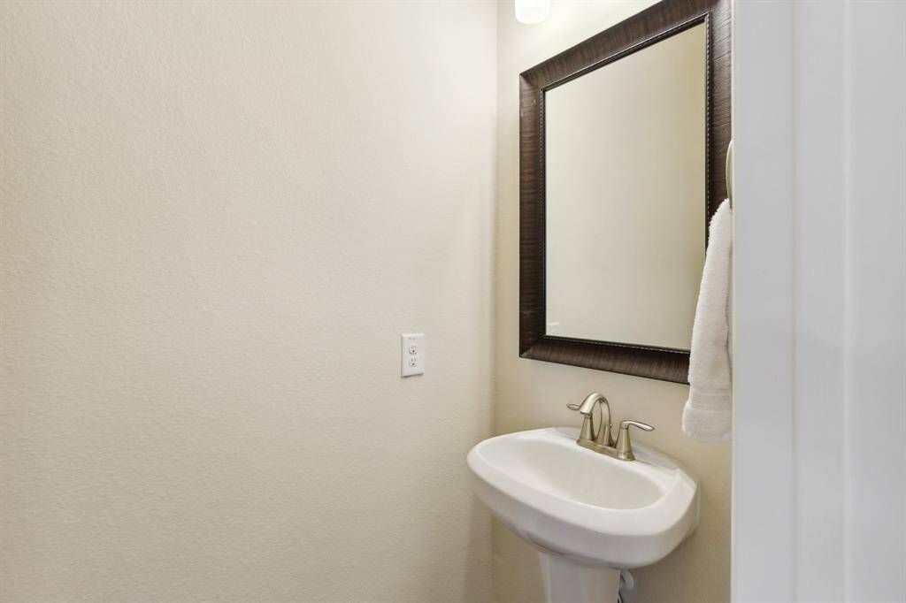 The conveniently located powder room to complete the second floor.