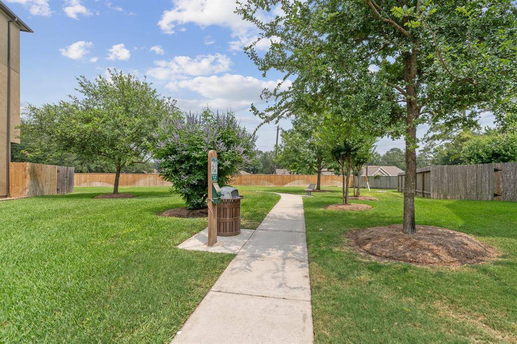 Located on a corner lot that overlooks this expansive green space with direct access to walking trails throughout the community.