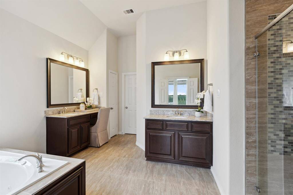Enjoy the convenience of a built-in vanity, offering a stylish spot to start and end your day with ease.