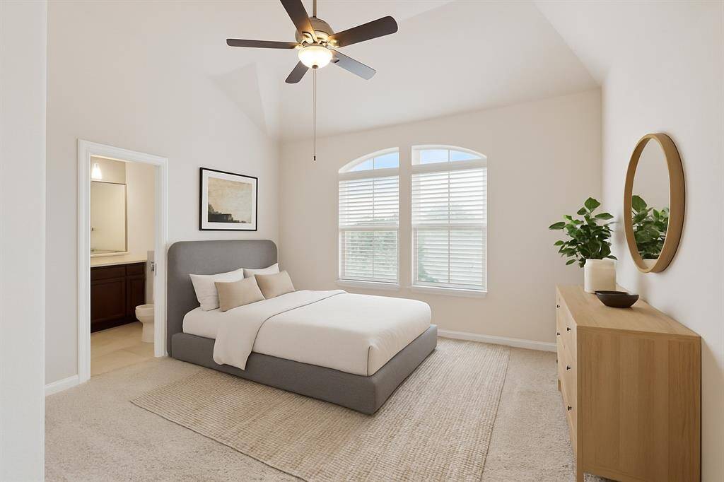 The third floor offers a spacious secondary bedroom featuring vaulted ceilings and its own ensuite bath. This room is virtually staged.