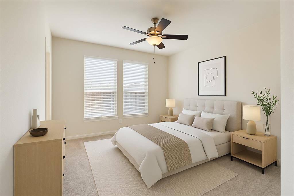 The home's third bedroom is thoughtfully located on the first floor and shares a full bathroom—perfect for guests or multi-generational living. This picture is virtually staged.