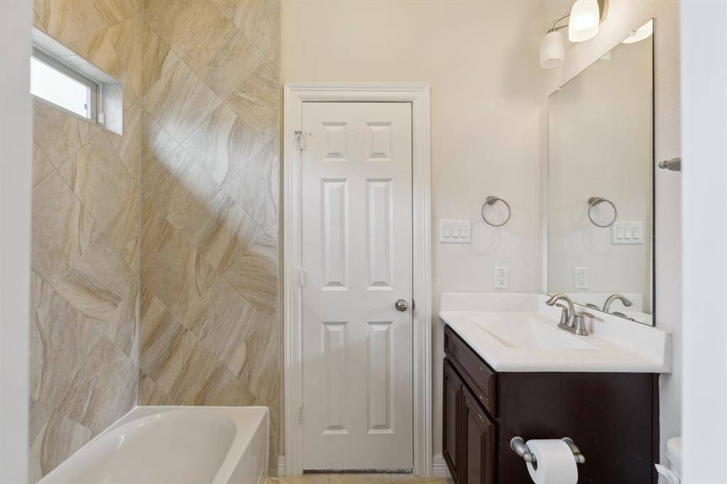The spacious first level bathroom with a shower/tub combo.