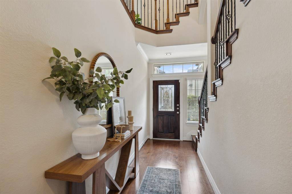 Step inside to the home's grand entryway where you'll be captivated by the elegant design and attention to detail.