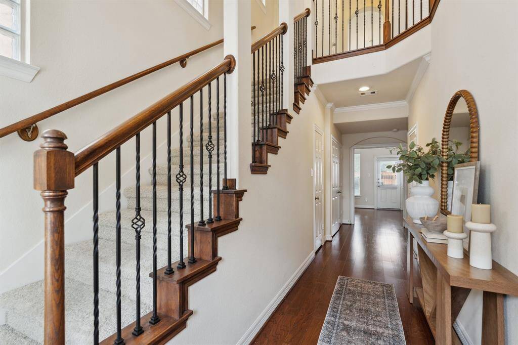 On the first floor you'll find a secondary bedroom, dedicated office, full bathroom and access to the 2 car garage and backyard. The garage has been upgraded with an EV charging outlet.