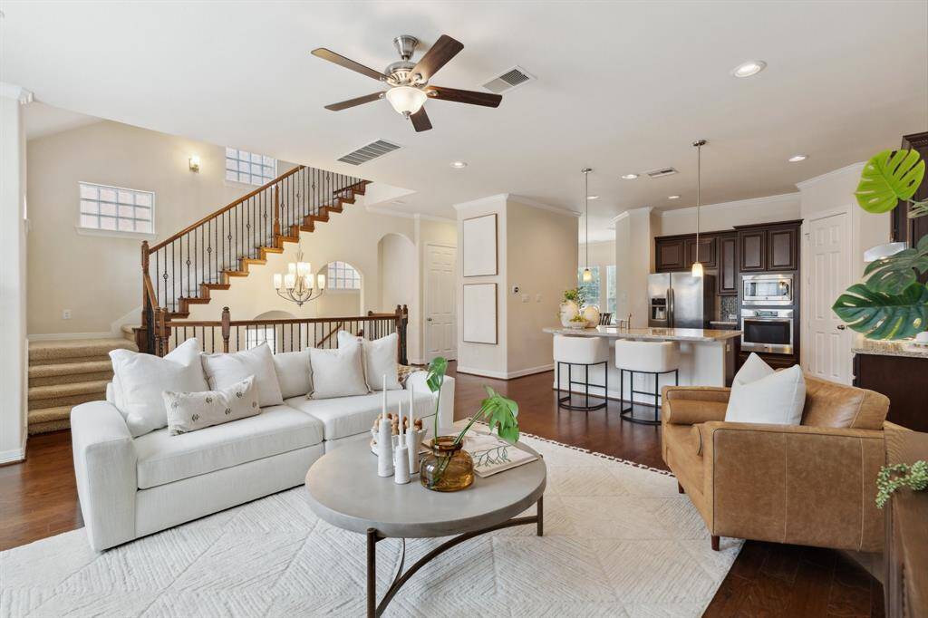 Another perspective of the open-concept living area as it seamlessly flows into the kitchen.