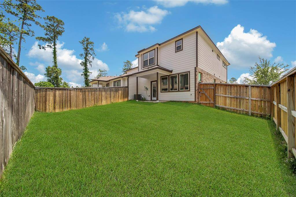 Spacious backyard fully fenced with back porch that could easily be extended given all that space!