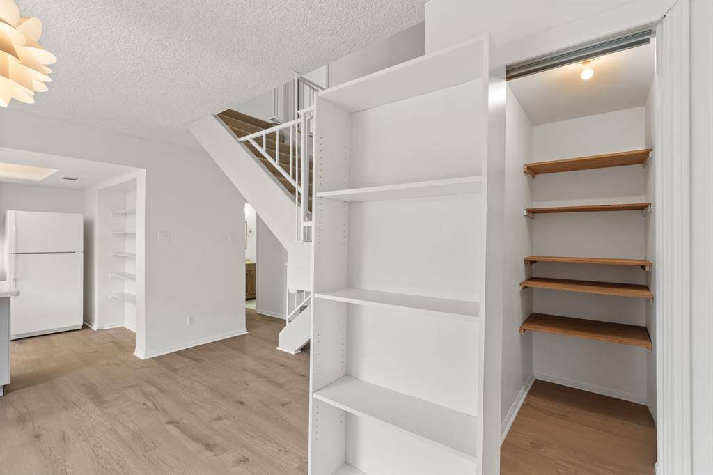 Beyond the bookshelf - discover the upgraded hidden closet behind the sliding bookshelf.