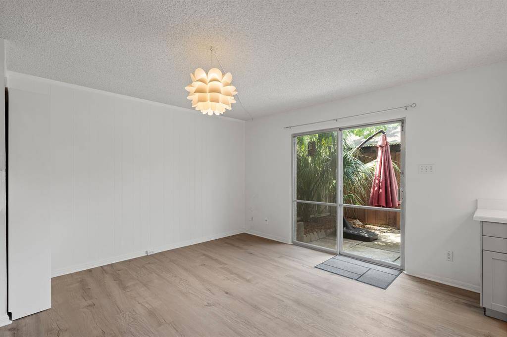 Dining Room has lots of natural light with large sliding patio doors overlooking the private terrace.