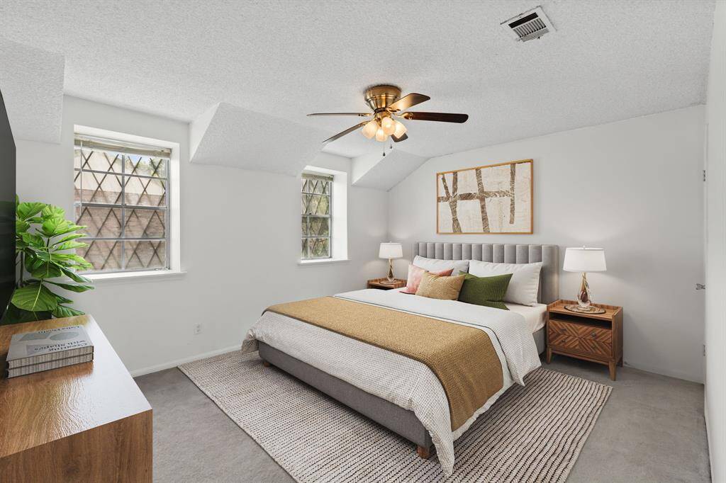 The Primary Retreat has patterned glass windows that add charm and natural light. Virtually Staged