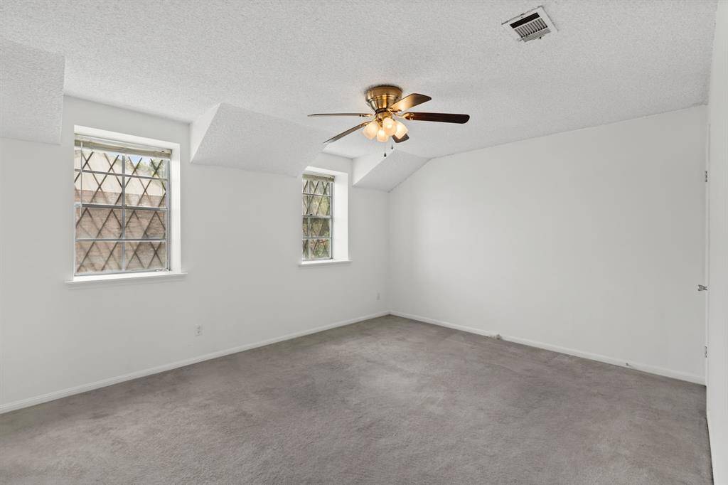 The Primary Retreat has patterned glass windows that add charm and natural light.