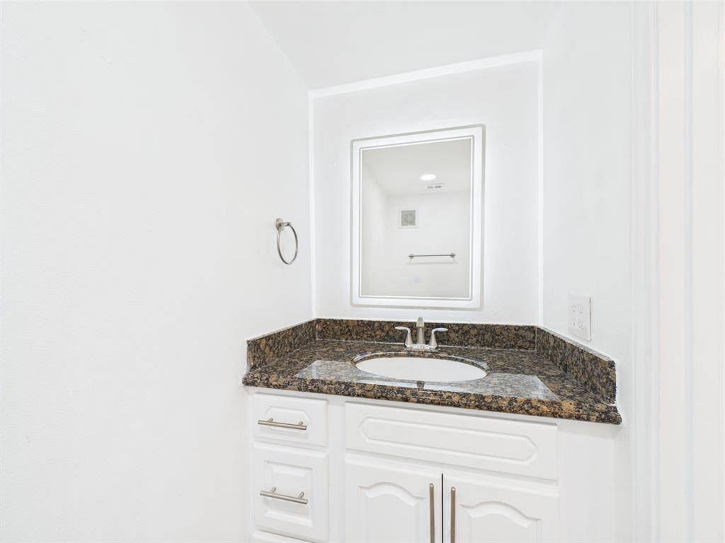 Updated Powder with Backlit Mirror off the Living Area