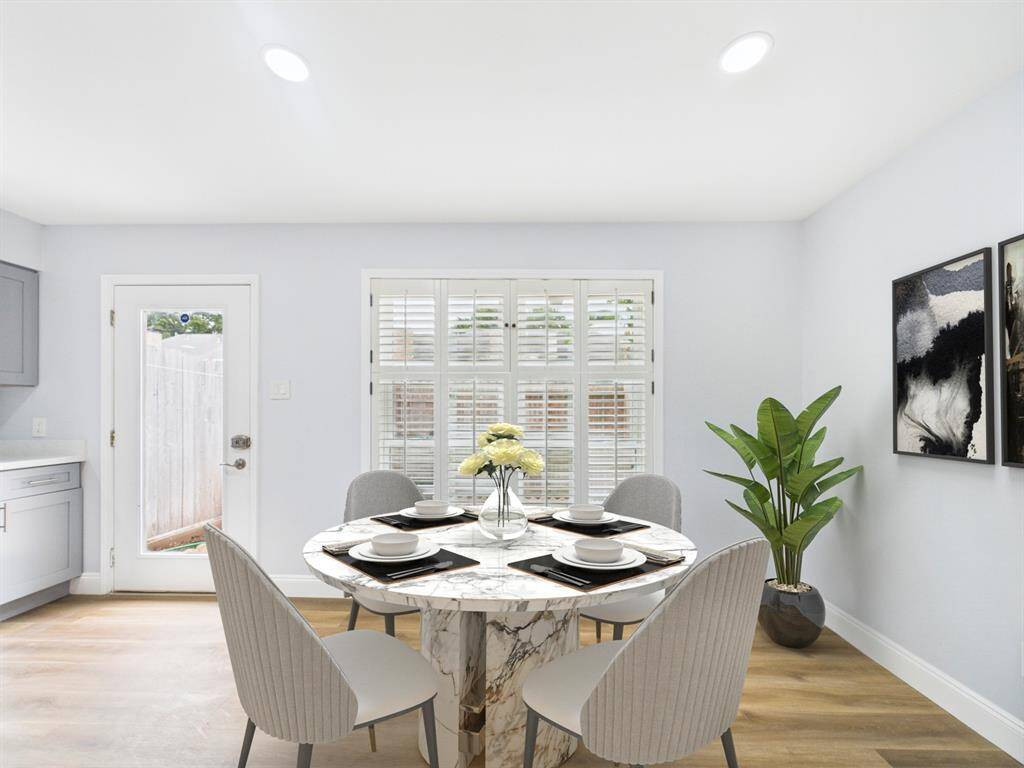 Dining/Breakfast Room with Large Window and Plantation Style Shutters