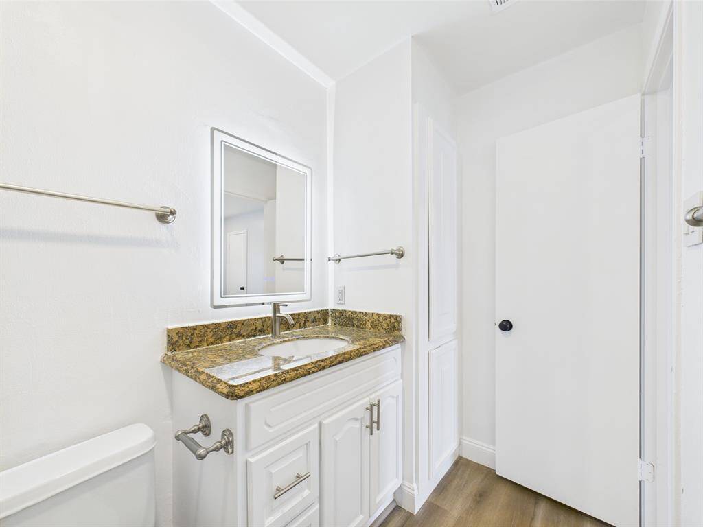 Vanity with Granite Counter & Linen Closet