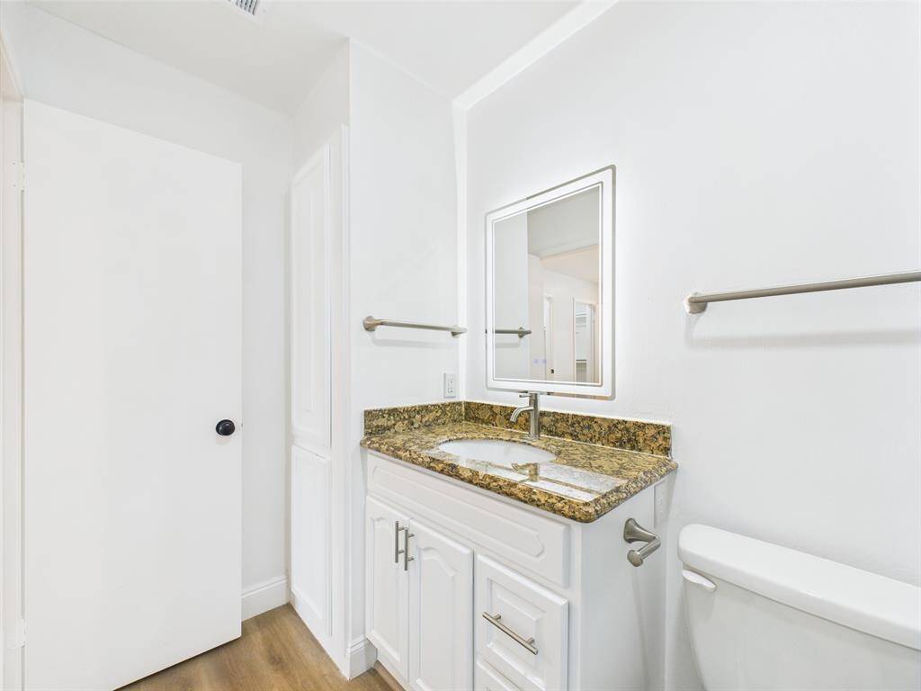 Vanity with Granite Counter & Linen Closet
