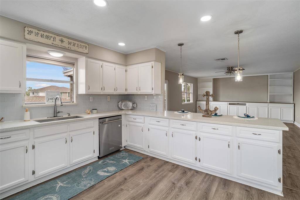 Open concept showing the kitchen into the living area, all on the water side