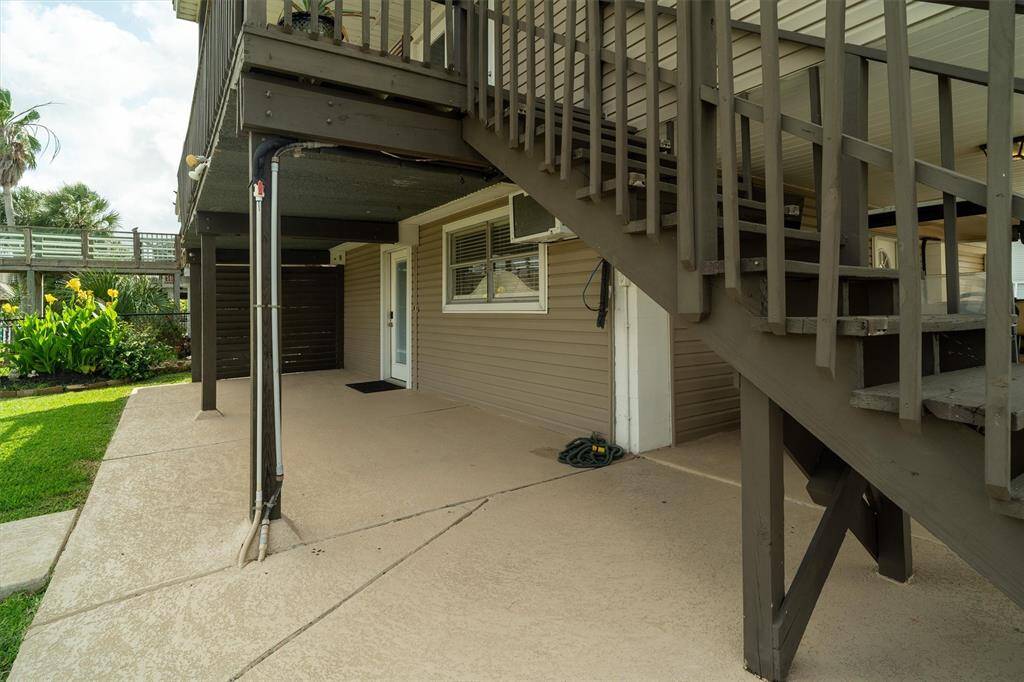 Notice all of the cool decking. There's plenty of room on this water side for outdoor furniture. There's a privacy wall and landscaping
