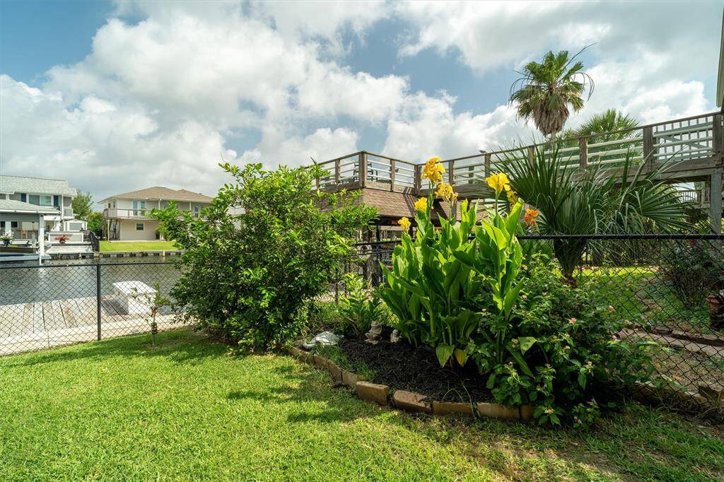 Landscaping and a fence to keep your pups and kids safe