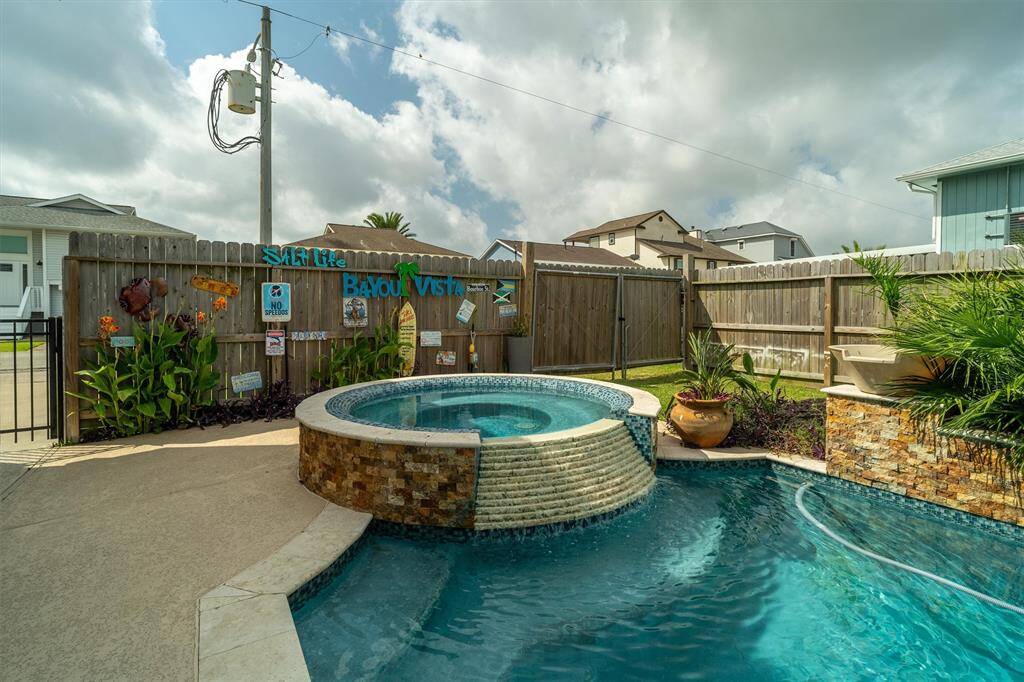 Spa with the stacked ledge with a pleasant water fall noise while you're in the pool. Very relaxing
