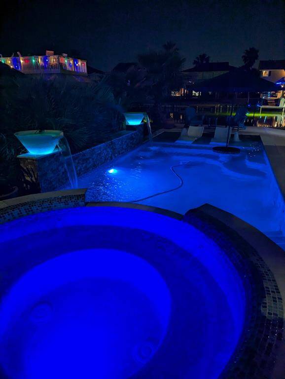 Love the pool lights at night. The light bowls on the wall are gorgeous