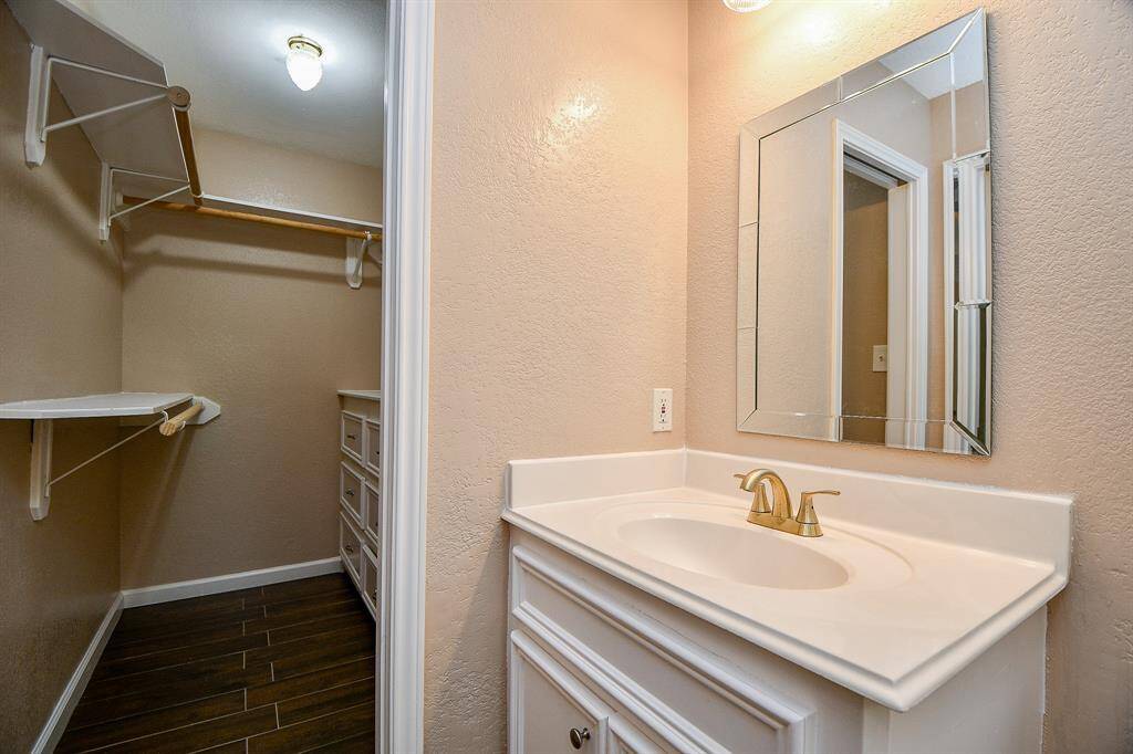 Another view of primary bathroom and walk in closet