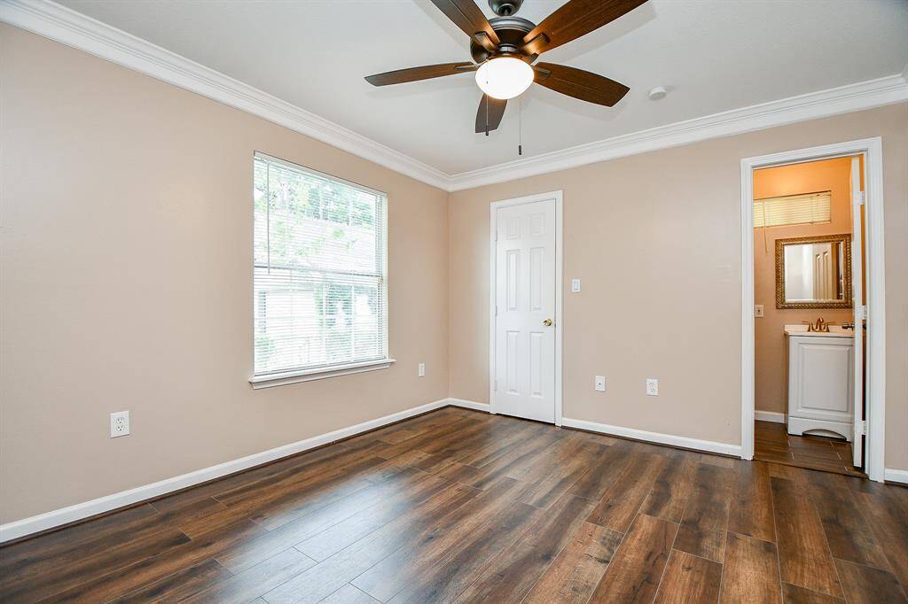 Fourth bedroom toward back of home with a 1/2 bath