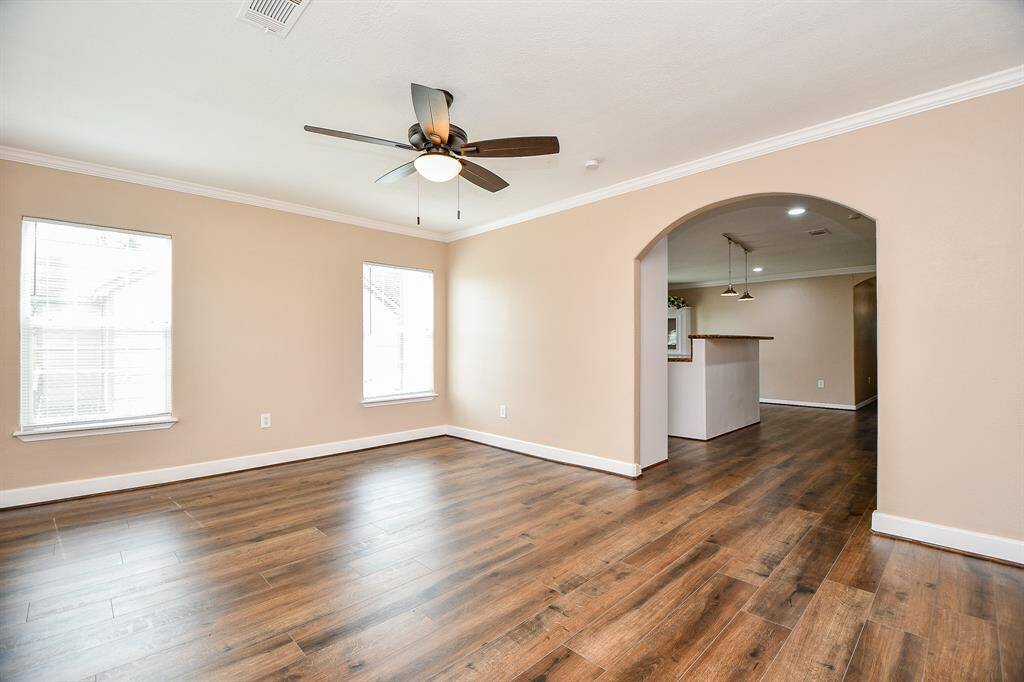 Living room area looking into kitchen/dining area