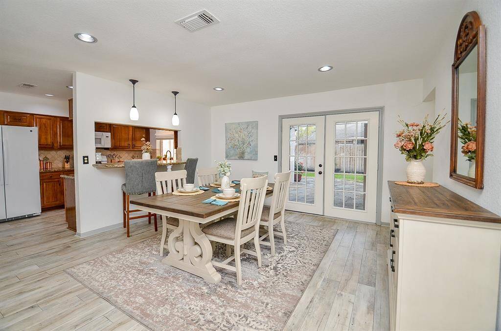 Seamless flow to the French doors leading out to the backyard.