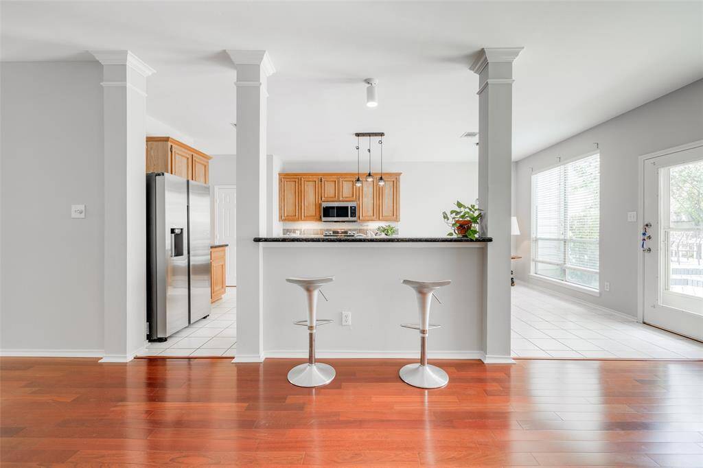Kitchen on open plan to Living Room, breakfast bar