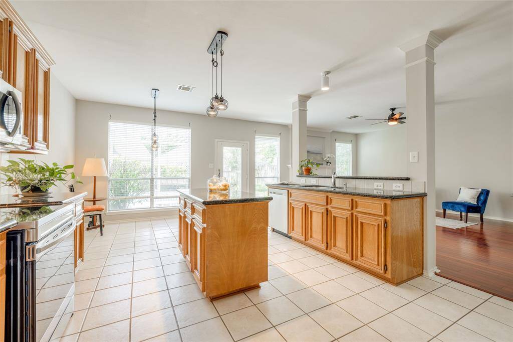 Large kitchen with black chandelier