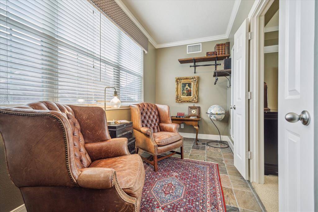 This private room off the primary bedroom is perfect for a home office or nursery.