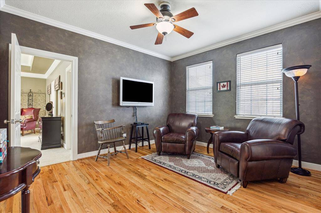 The home features multiple living areas including this space outside the primary bedroom.