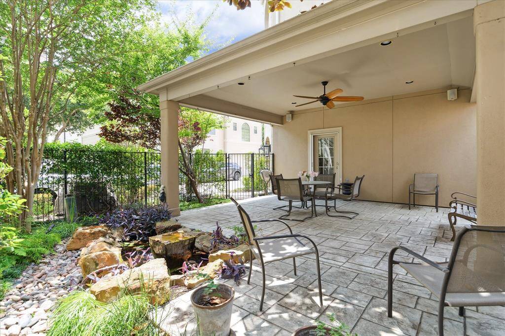 The large covered terrace provides an additional living area overlooking the koi pond and fountain.