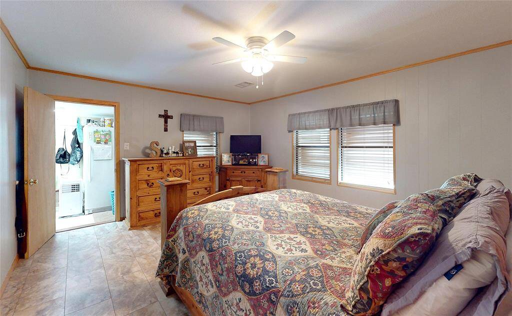 Primary bedroom with private balcony and