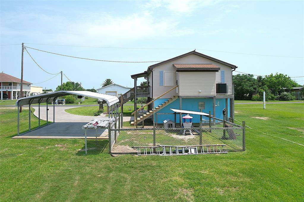 Rear of house w/ dog yard