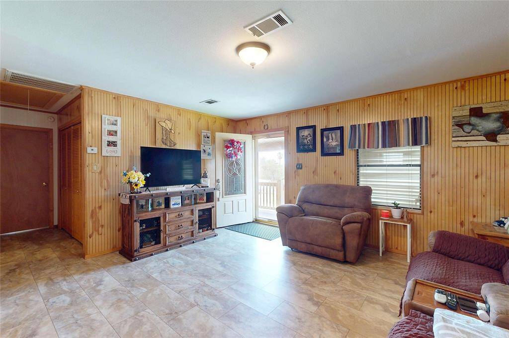 Spacious, open living room decorated with a modern country