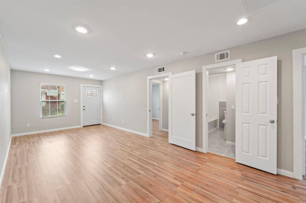 Spacious living room upon entry.