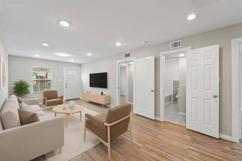 Spacious living room upon entry. [virtually staged]