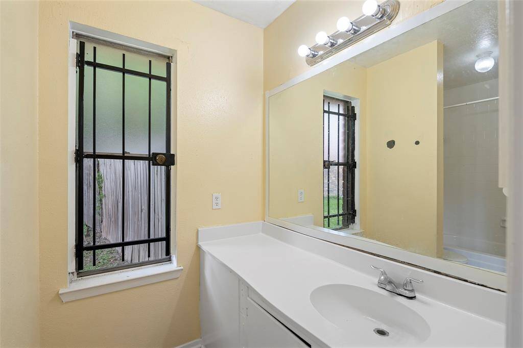 An ensuite bath with cabinets for storage and a large mirror for those quick morning checks before heading out the door!