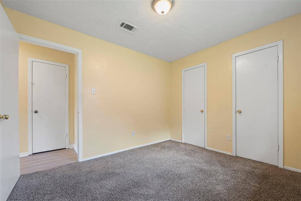 This secondary bedroom features dual closets for all your storage needs!
