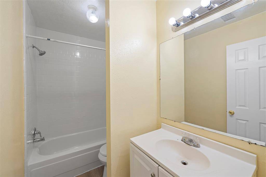A full-sized bathroom with private wet areas is a shared space for the secondary bedrooms!