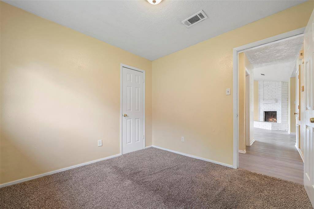 This bedroom has a cool spot in the corner so you can sit and look at the fireplace when the door is open!